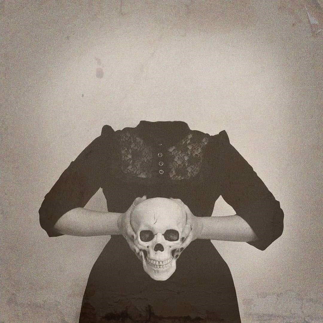 Headless woman holding a skull